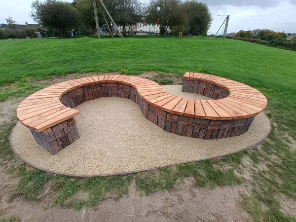 Curved gabion and timber social seating at Brickfields park - Monkey Business Design