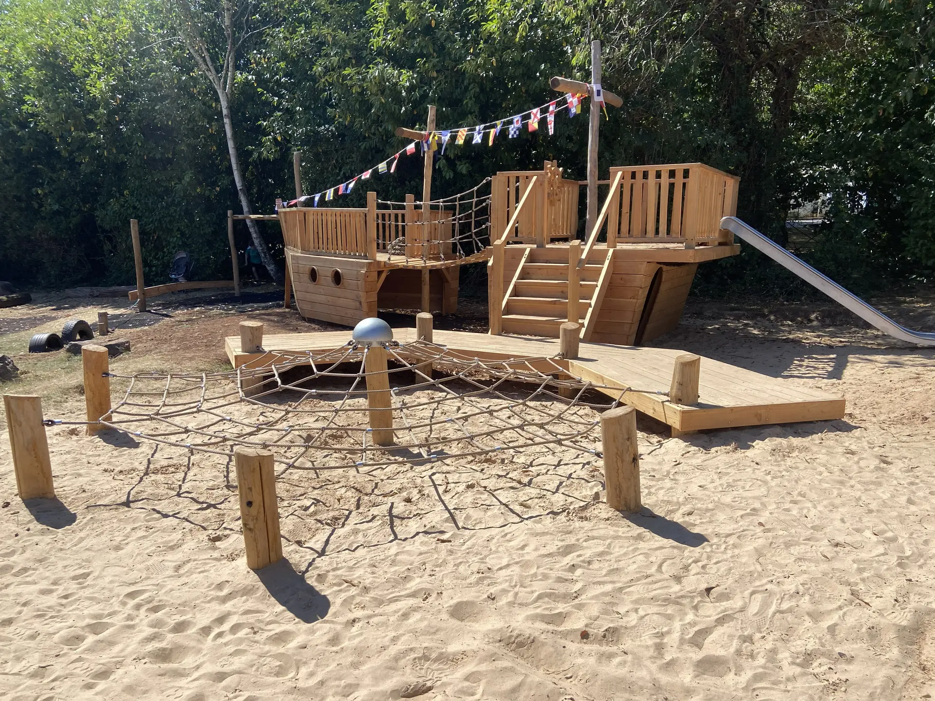 Timber galleon play structure with climbing net built by Monkey Business Design at Brockwell Park, Wick, Gloucestershire