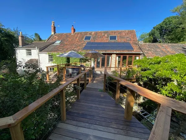 Timber bridge over a mill stream at Mill House, Somerset - Monkey Business Design